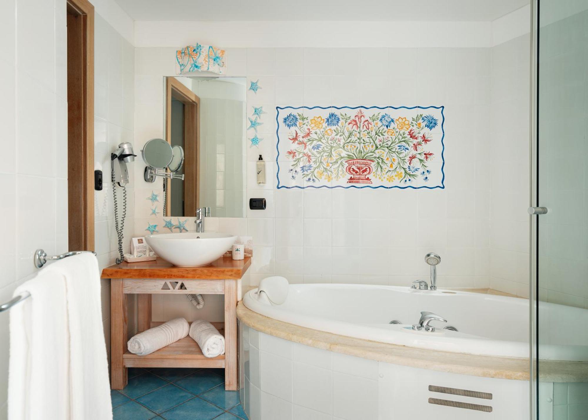 & Baia Caddinas Hotel 4*